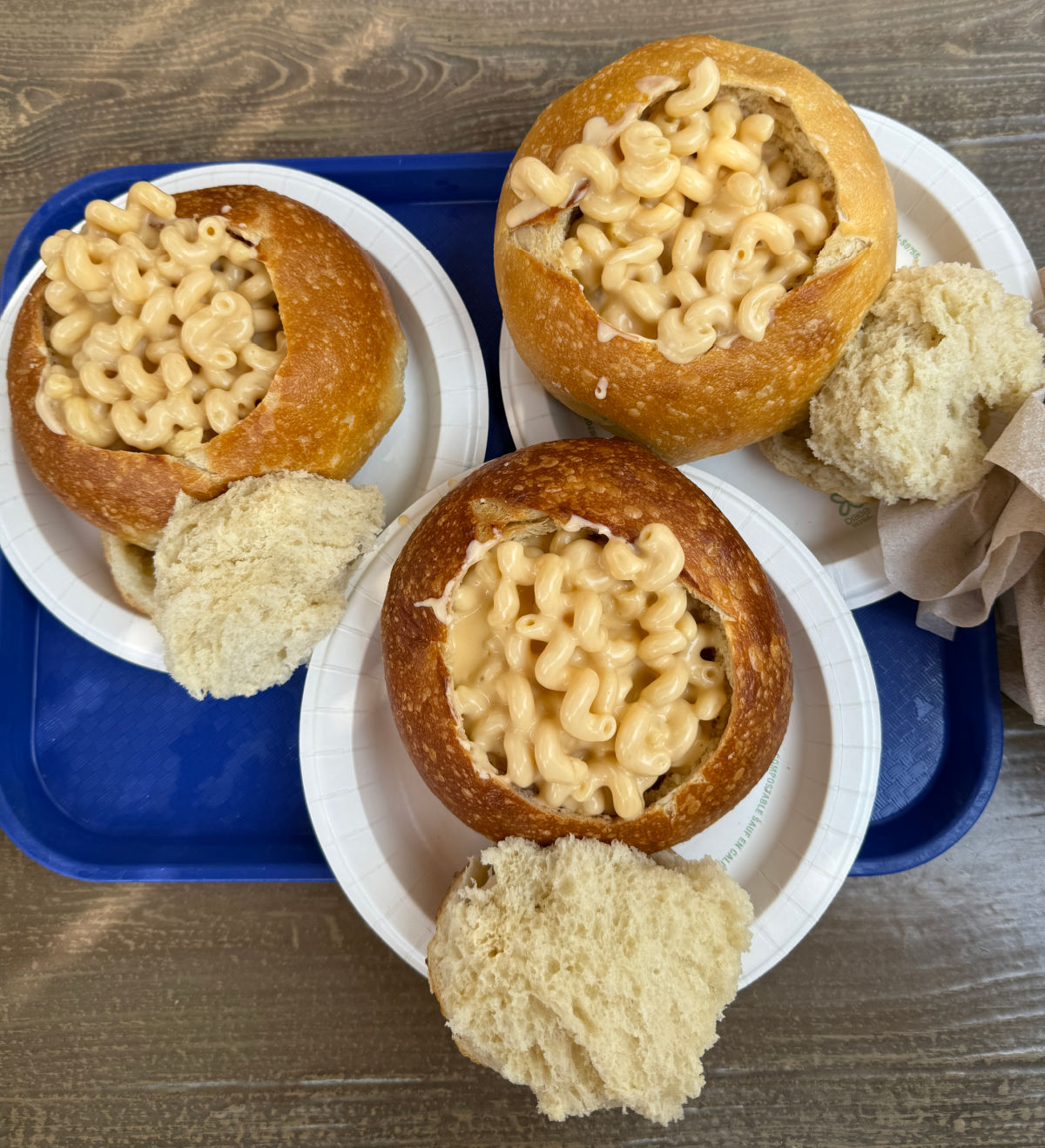 A tray with three mac and cheese bread bowls from San Fransokyo.